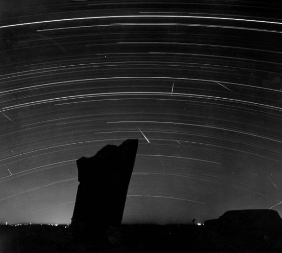 Photograph of comet against Teeter Rock,
KS