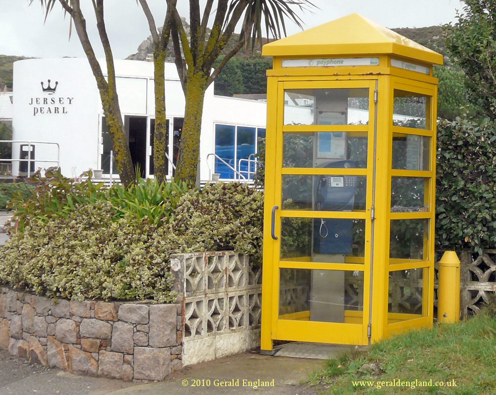 Les Laveurs: Yellow Phonebox outside Jersey Pearl