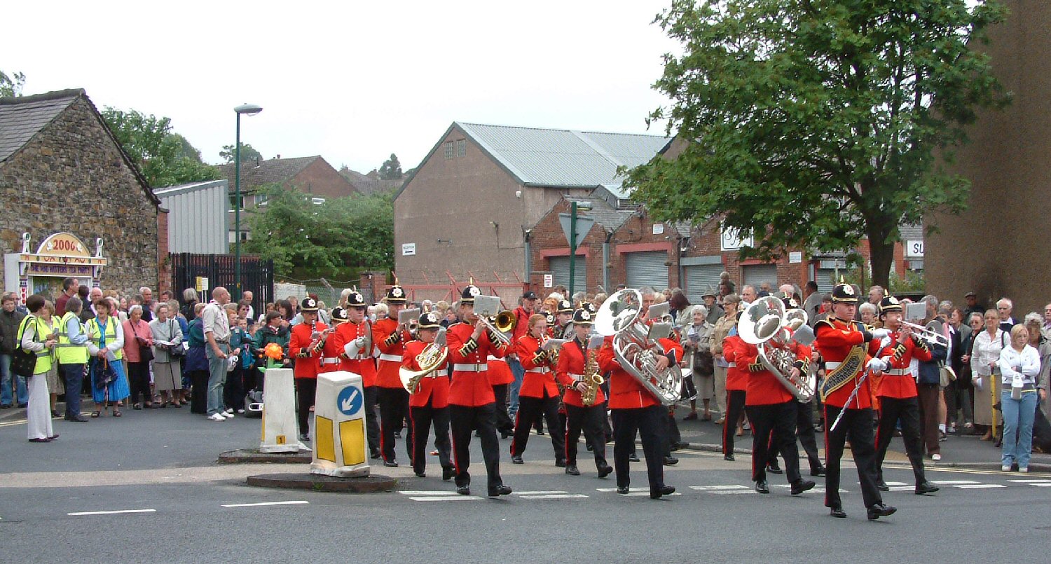 The Adamson's Band leading the procession from Booth's Well